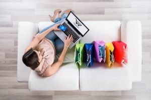 Woman-Shopping-Online-On-Laptop-598559200_2124x1417