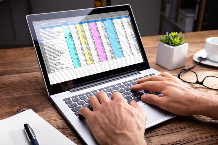 Person’s Hand Using Laptop Managing product data efficiently