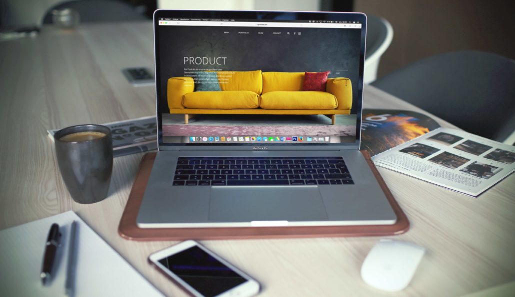 image of a laptop with a sofa being displayed for sale
