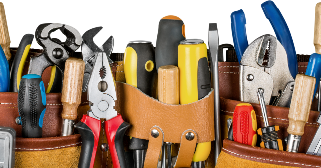 Image of many tools in a leather tool belt