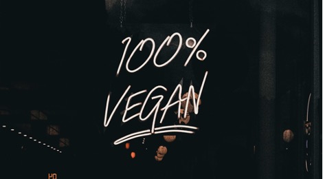 image of a neon sign saying 100% vegan