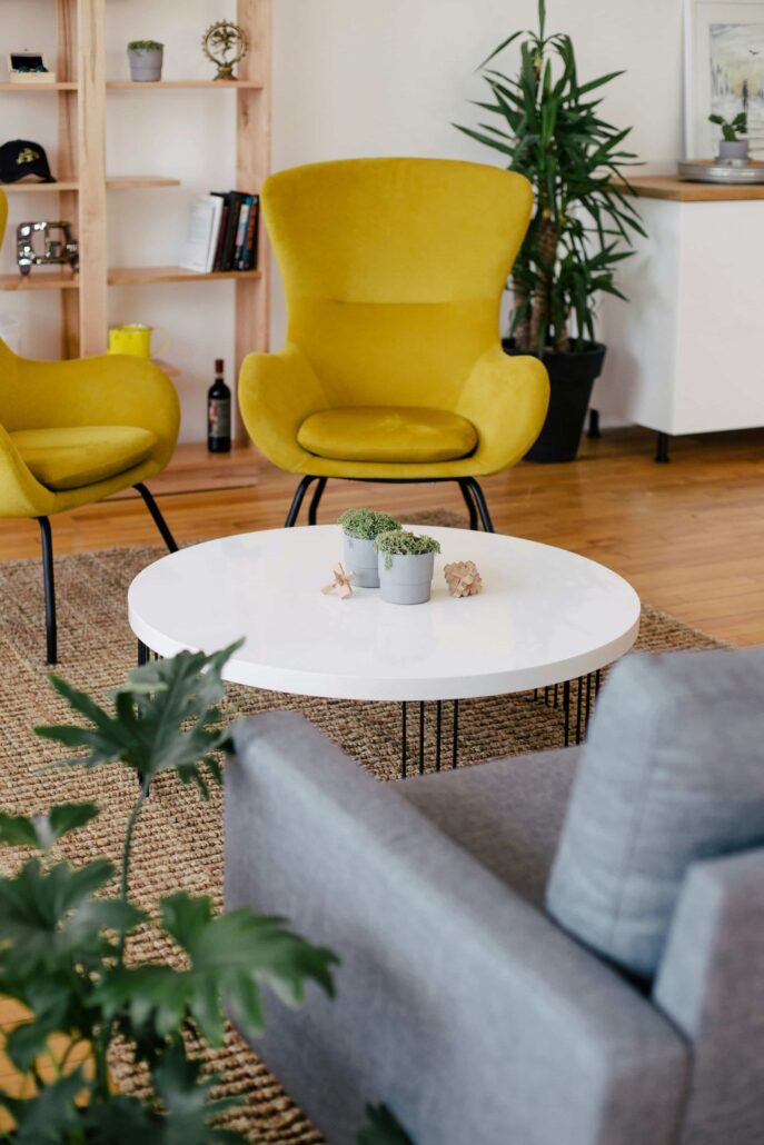 image of two yellow chairs around a coffee table