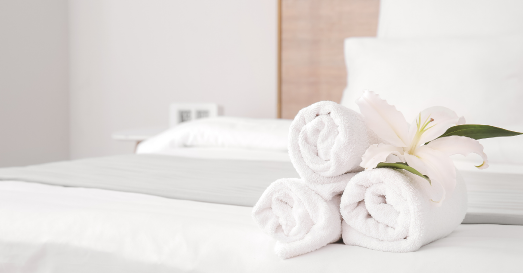Photo of towels folded on a hotel bed